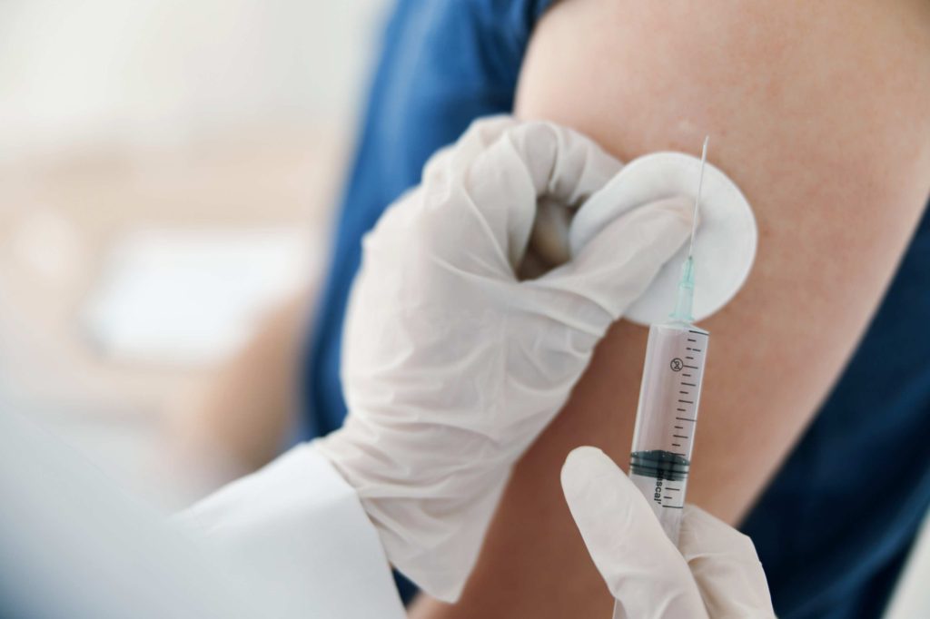 Patient receiving a flu vaccination at Anna Pharmacy in Carshalton